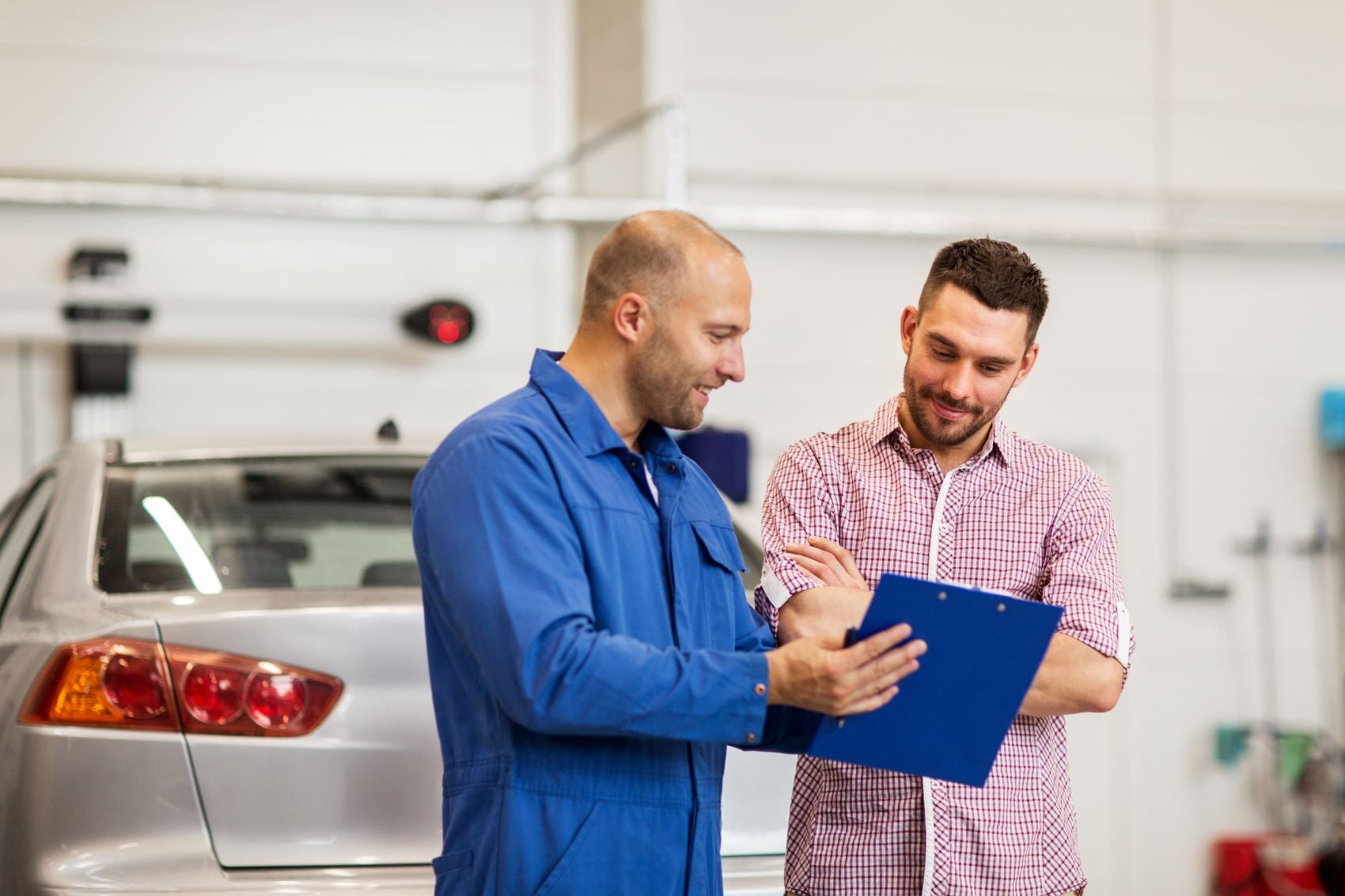 Expert Detailing EV Maintenance Needs to Customer